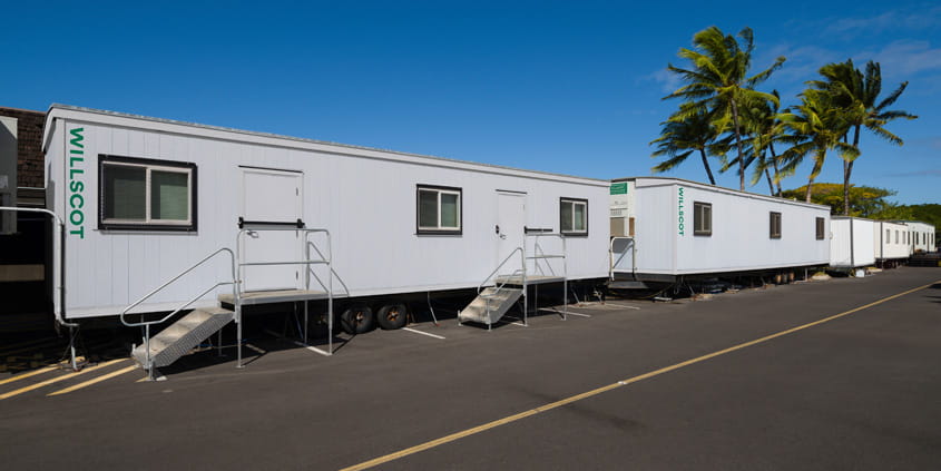 Mobile office trailers lined up with steps installed